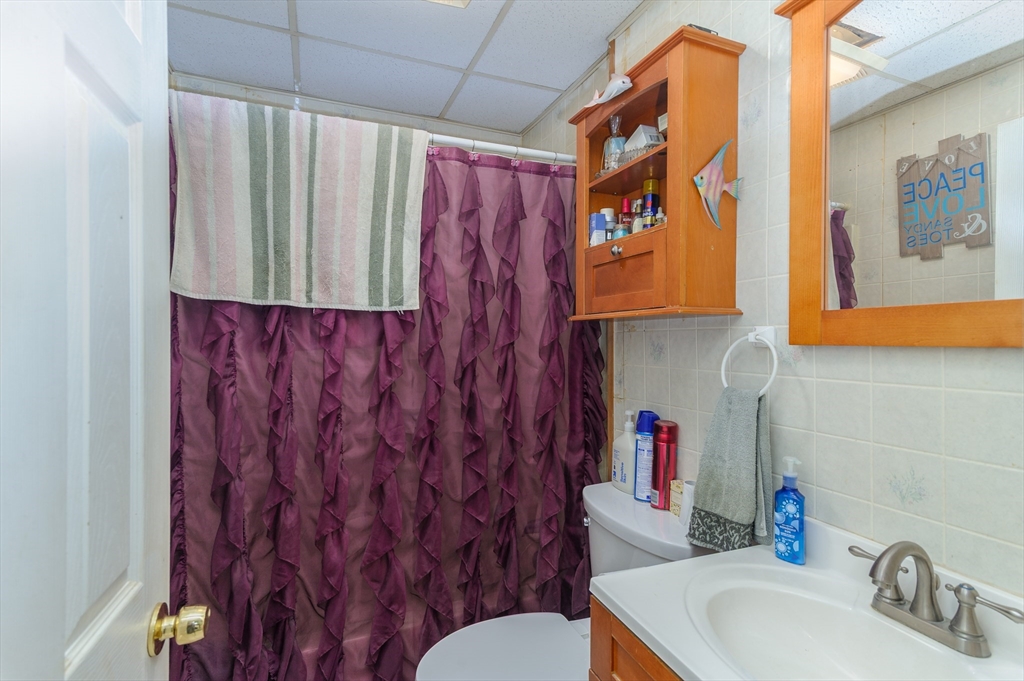52 Grove Street Spencer, MA 01562 - Photo 7 of 24 a bathroom with a sink and a toilet