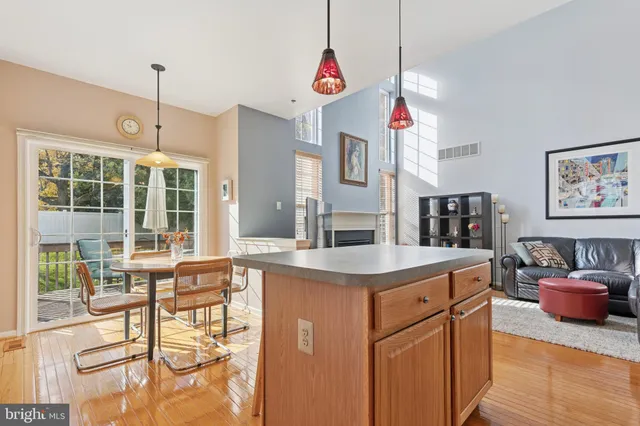 a bathroom with a sink vanity granite and toilet