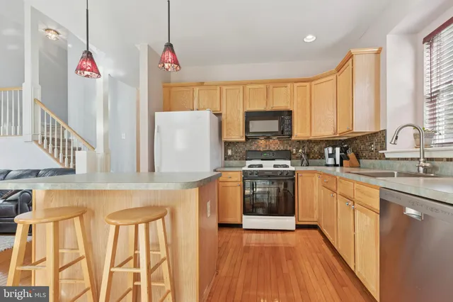 a living room with furniture a couch and a window