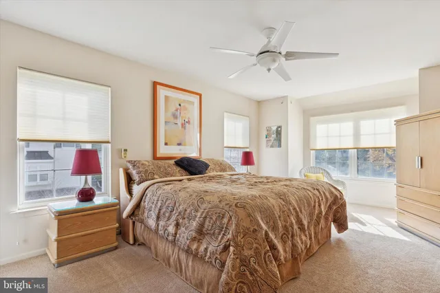 a bed room with a bed and a window