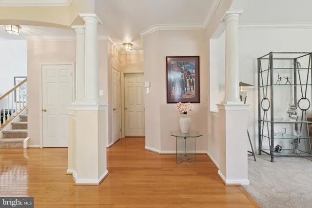 a dining room with furniture and wooden floor