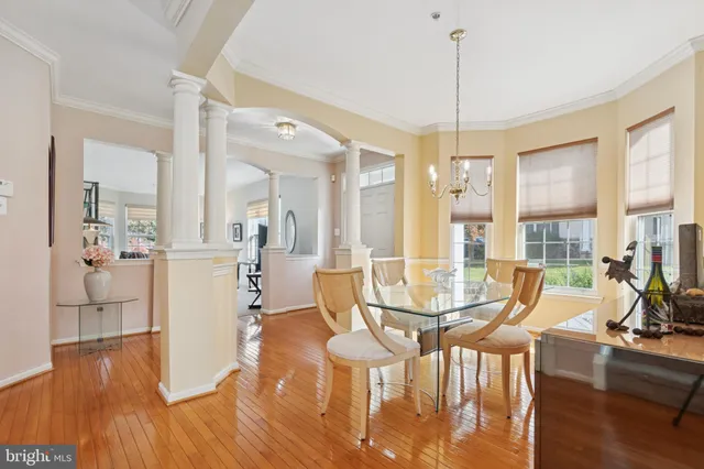 a kitchen with granite countertop a refrigerator stove top oven and sink