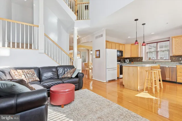 a living room with furniture or kitchen and a chandelier