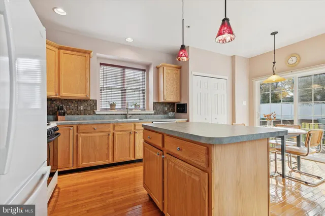 a kitchen with stainless steel appliances granite countertop a sink and cabinets