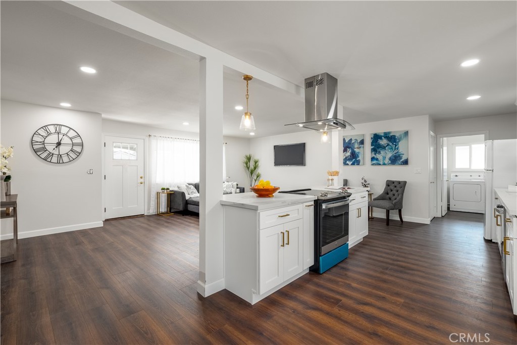 29110 Prestwick Road Menifee, CA 92586 - Photo 12 of 32 a kitchen with furniture and a wooden floor