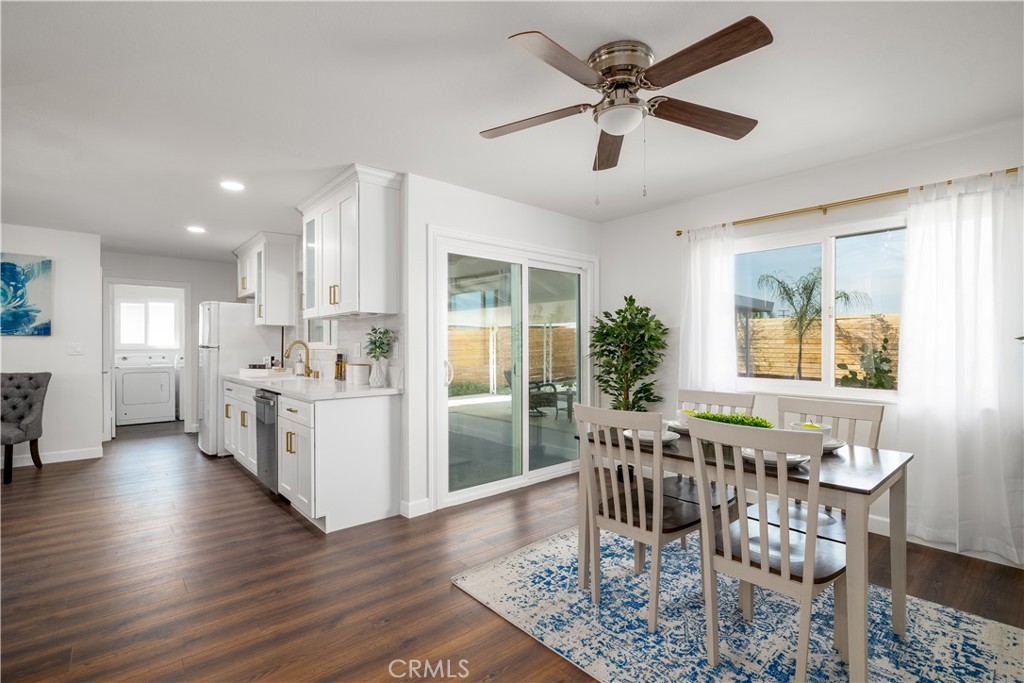 29110 Prestwick Road Menifee, CA 92586 - Photo 14 of 32 a view of a dining room with furniture and wooden floor
