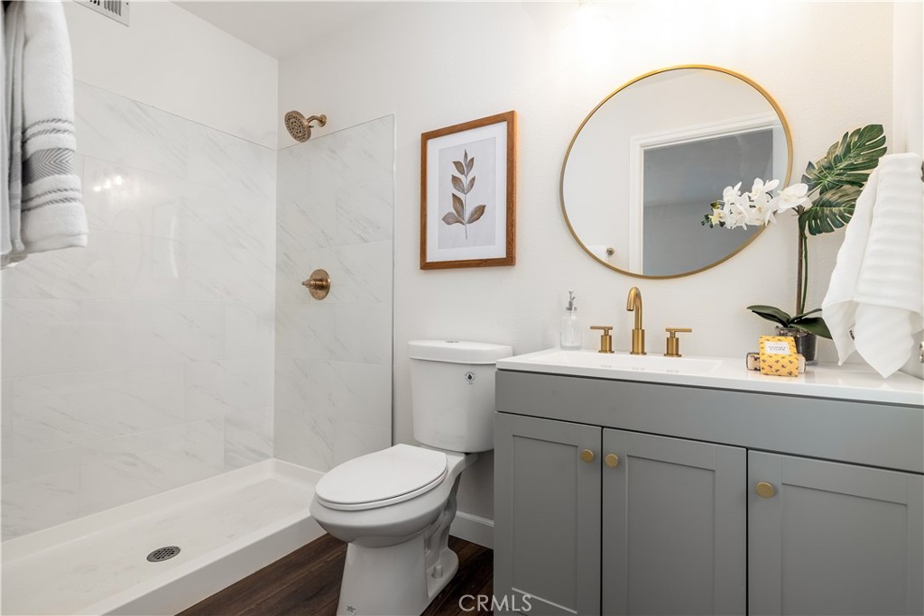 29110 Prestwick Road Menifee, CA 92586 - Photo 23 of 32 a bathroom with a sink mirror and toilet