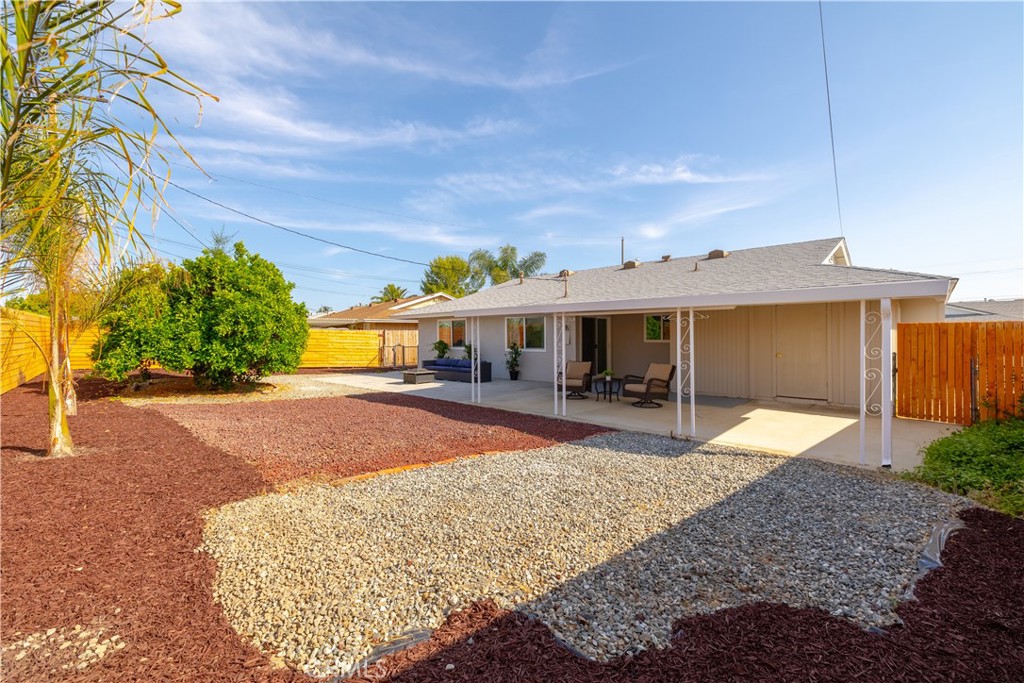 29110 Prestwick Road Menifee, CA 92586 - Photo 29 of 32 a front view of a house with a yard and garage