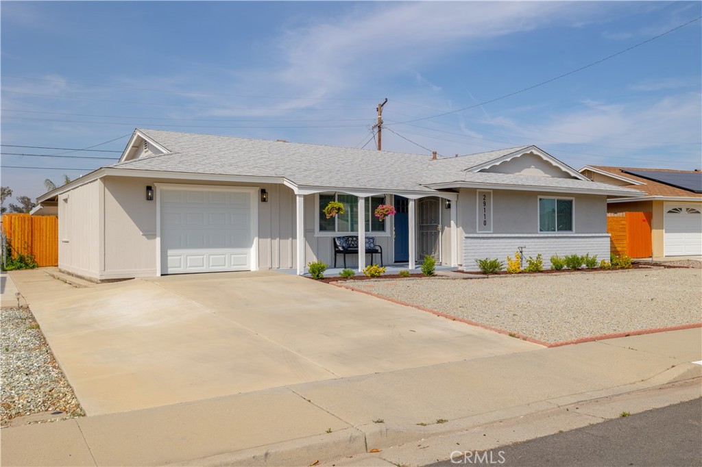 29110 Prestwick Road Menifee, CA 92586 - Photo 3 of 32 a front view of a house with a garage