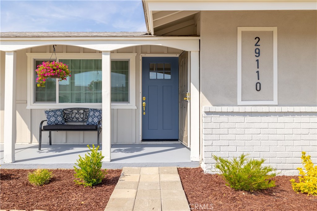 29110 Prestwick Road Menifee, CA 92586 - Photo 7 of 32 a front view of a house with a yard