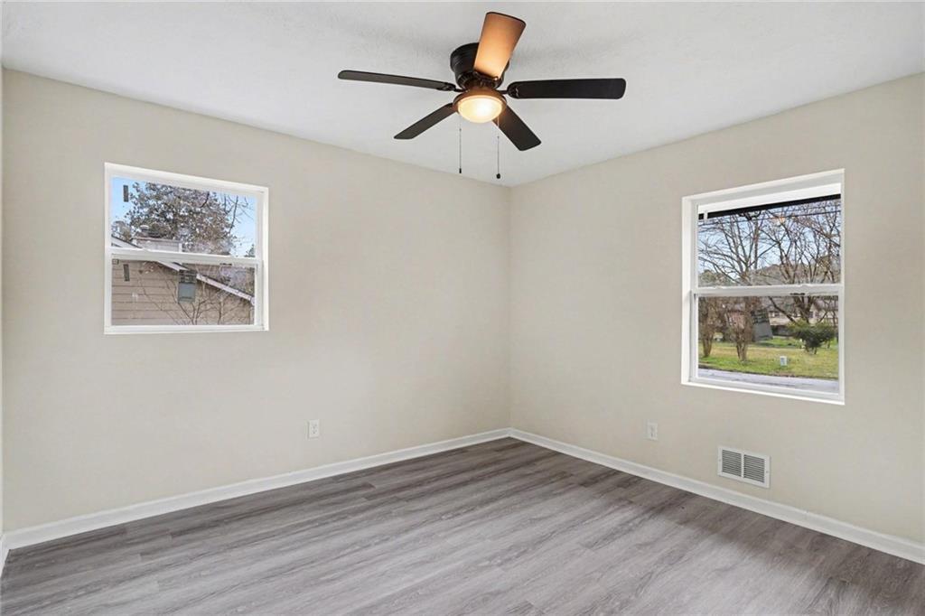 8355 Dunellen Lane Jonesboro, GA 30238 - Photo 21 of 27 a view of empty room with wooden floor