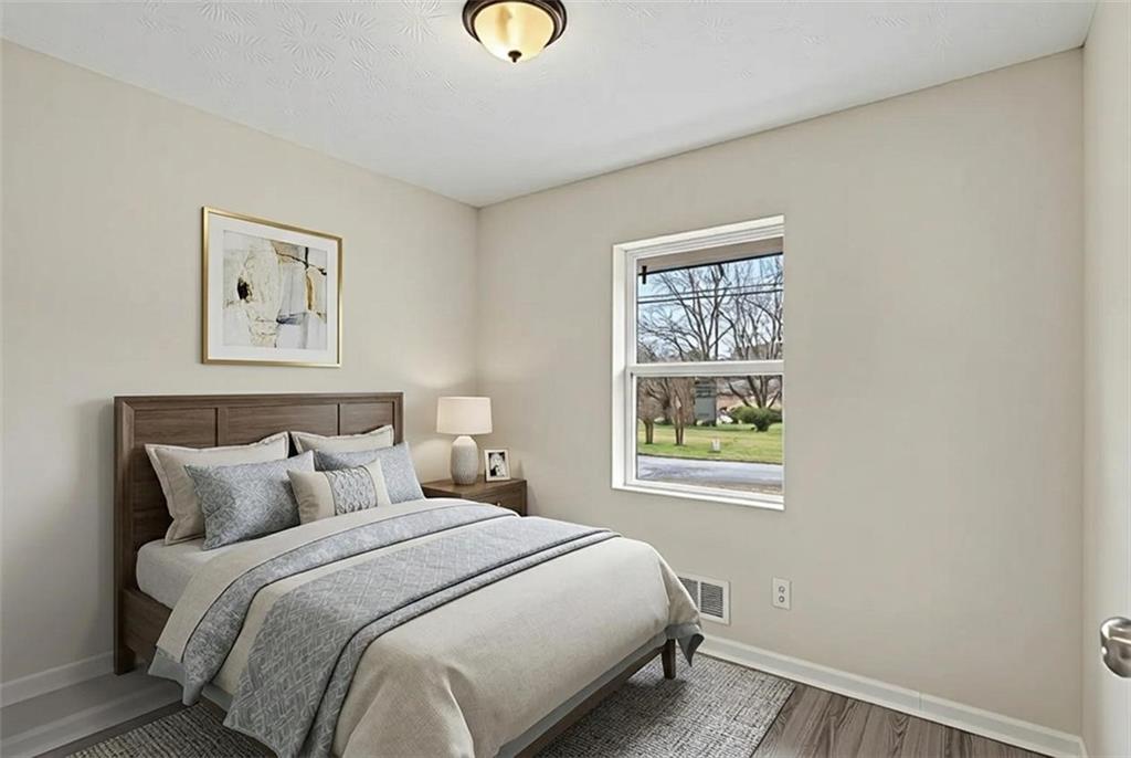 8355 Dunellen Lane Jonesboro, GA 30238 - Photo 24 of 27 a bedroom with a bed and a window