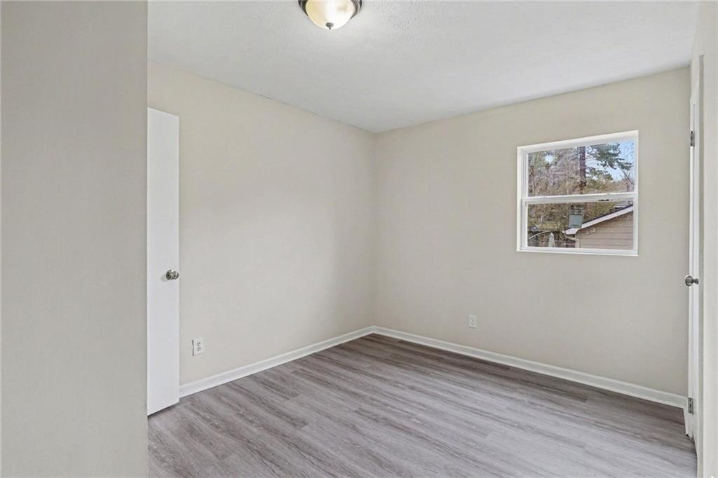 8355 Dunellen Lane Jonesboro, GA 30238 - Photo 25 of 27 wooden floor in an empty room