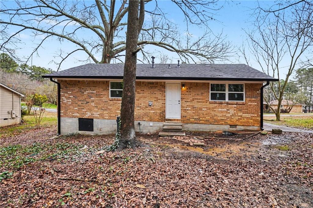8355 Dunellen Lane Jonesboro, GA 30238 - Photo 27 of 27 a front view of a house with a yard