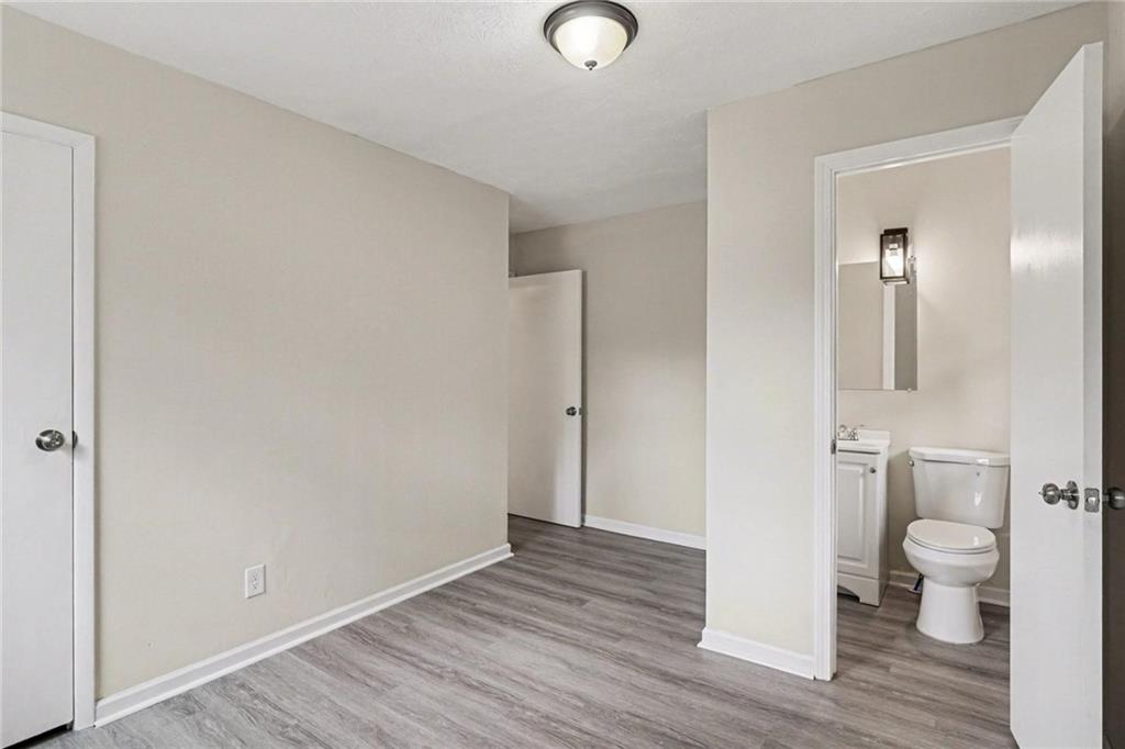 8355 Dunellen Lane Jonesboro, GA 30238 - Photo 4 of 27 a view of a bathroom with wooden floor