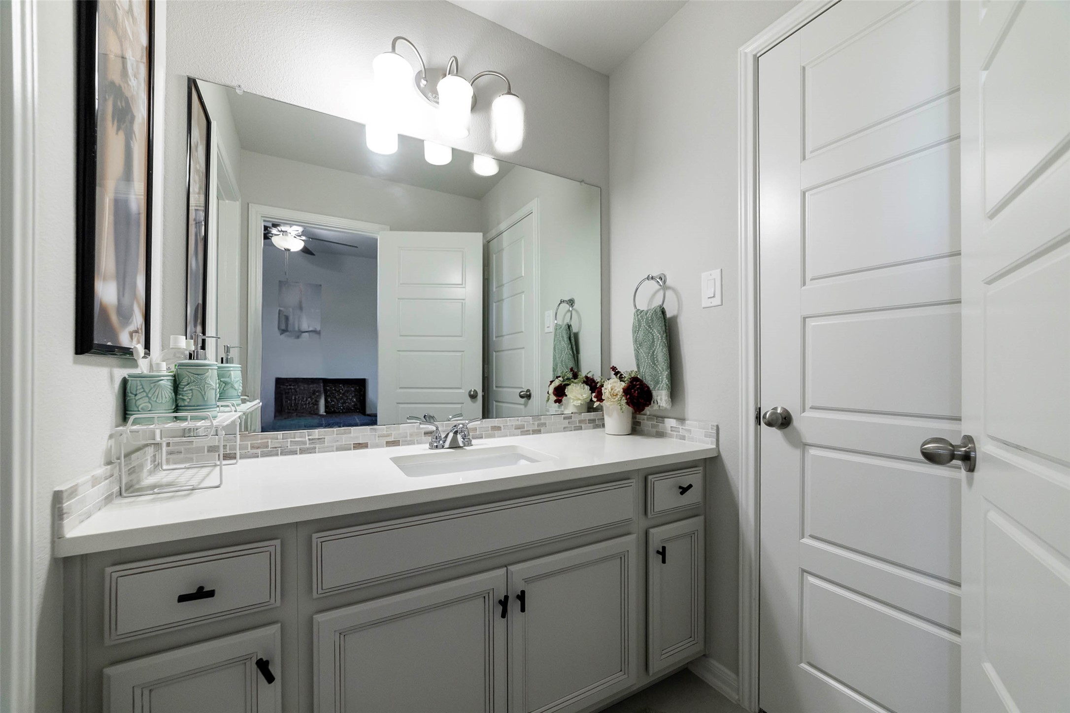 17821 Limestone Spring Lane Austin, TX 78738 - Photo 29 of 40 a bathroom with a sink double vanity and a mirror