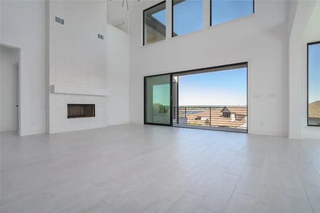 a view of a livingroom with a fireplace and window