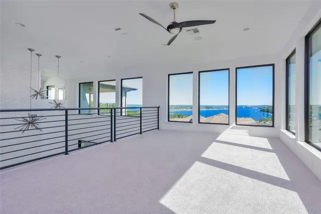 a view of an empty room with windows