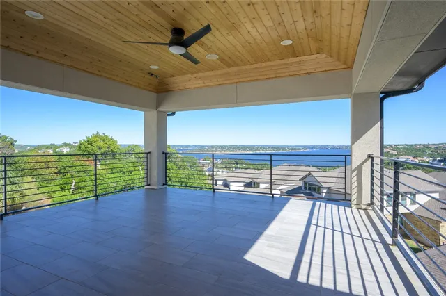 a view of a balcony with wooden floor