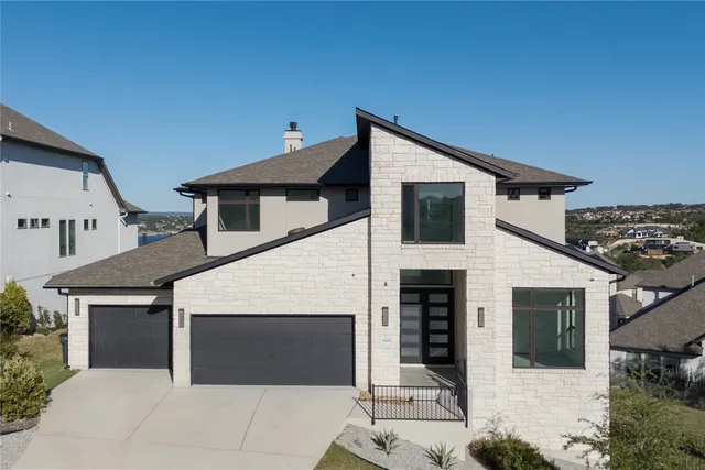 a front view of a house with glass windows