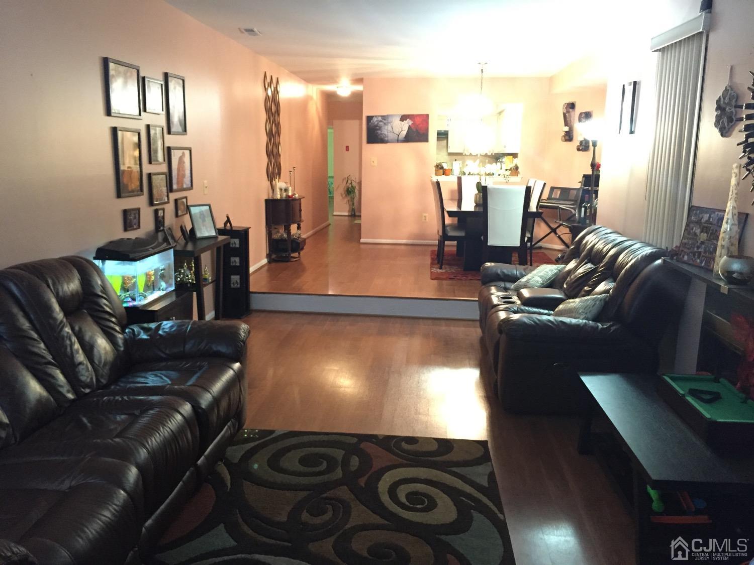 701 Jesse Way Piscataway, NJ 08854 - Photo 11 of 12 a living room with furniture and a floor to ceiling window