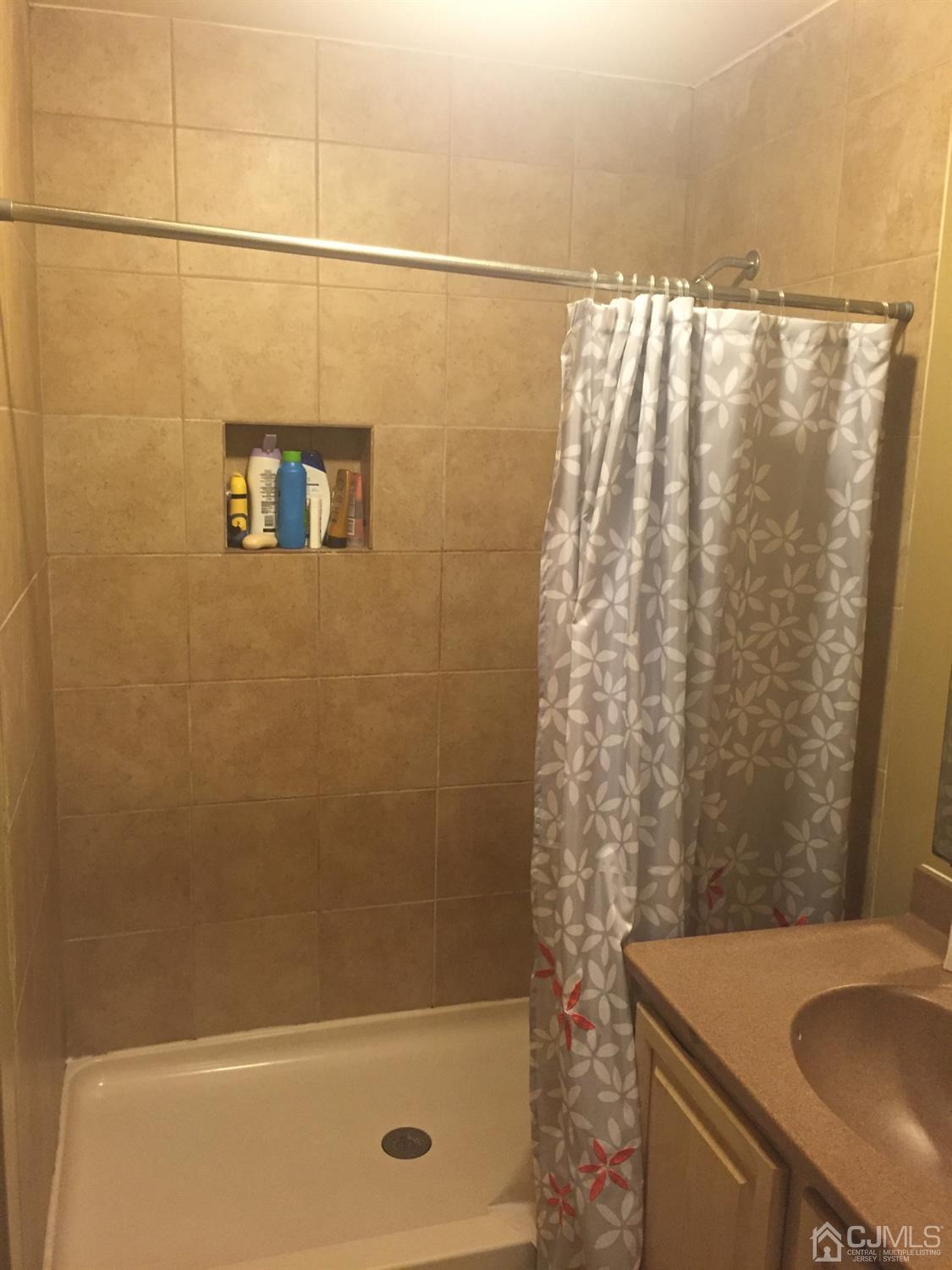 701 Jesse Way Piscataway, NJ 08854 - Photo 2 of 12 a bathroom with a sink and a shower