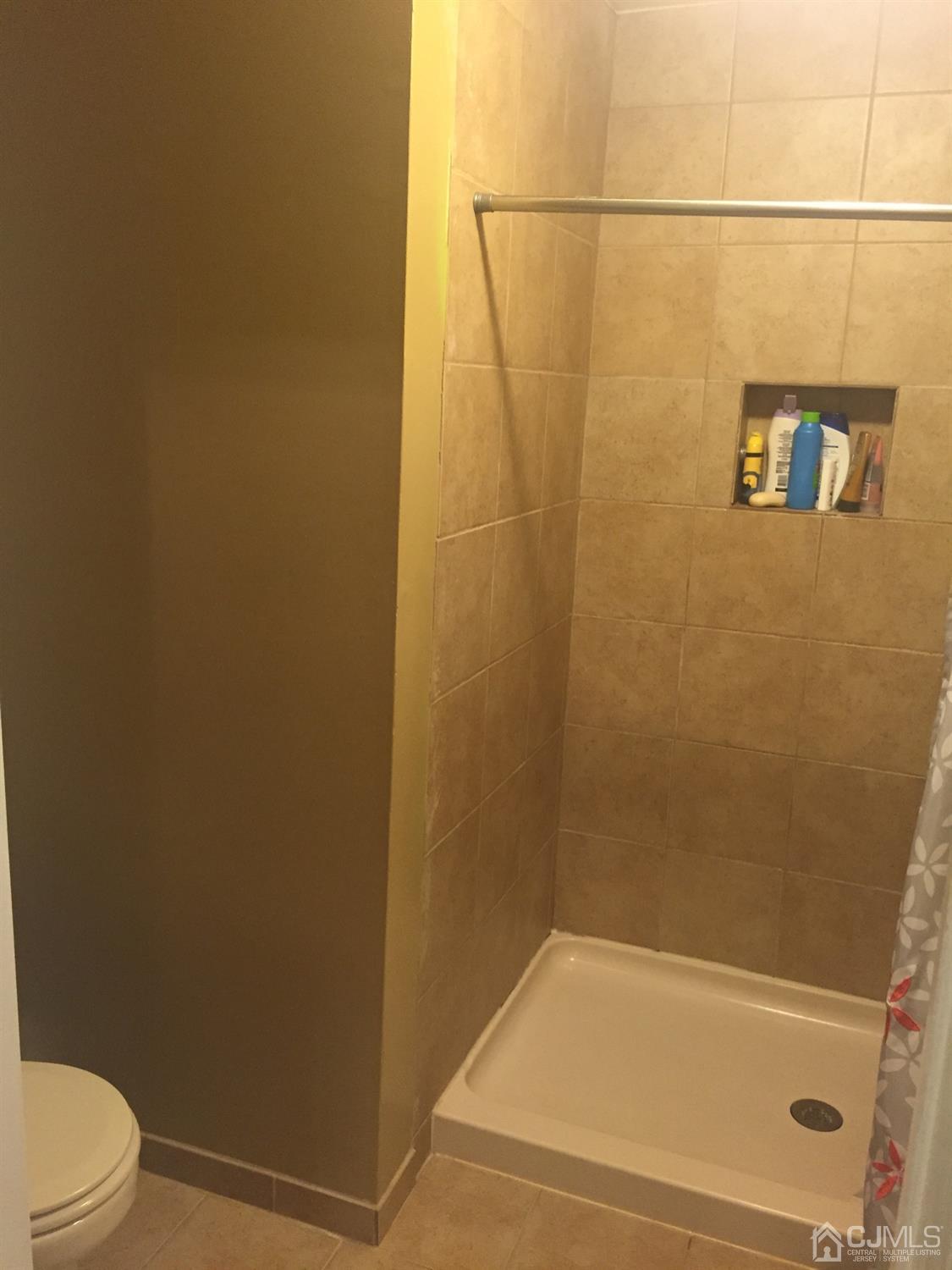 701 Jesse Way Piscataway, NJ 08854 - Photo 3 of 12 a bathroom with a shower and a toilet
