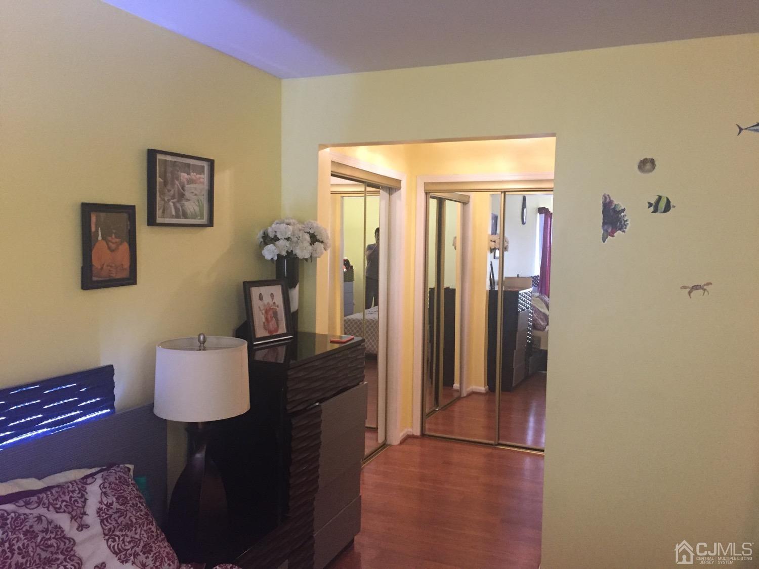 701 Jesse Way Piscataway, NJ 08854 - Photo 5 of 12 a hallway with furniture and wooden floor