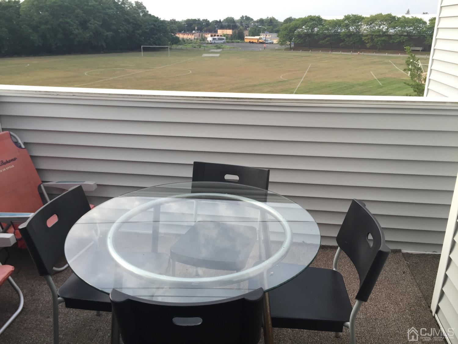 701 Jesse Way Piscataway, NJ 08854 - Photo 8 of 12 a view of a chair and table in the balcony