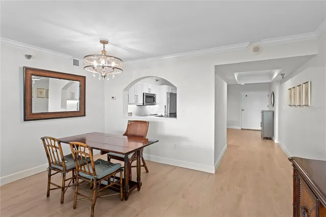 a living room with furniture and floor to ceiling window