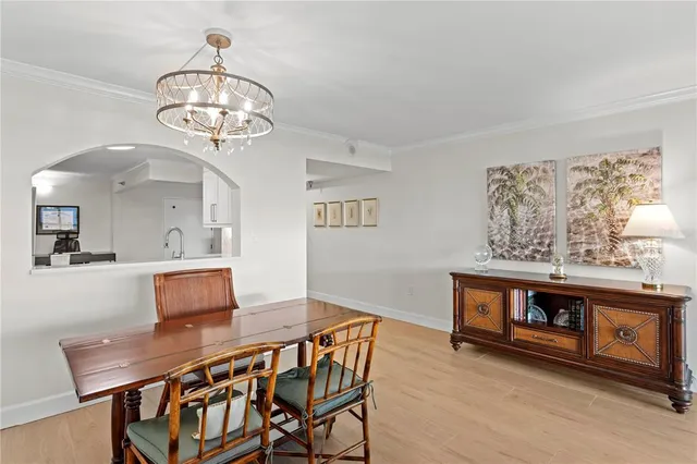 a reading room with furniture and a wooden floor