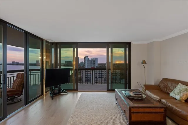 a living room with furniture a fireplace and a table