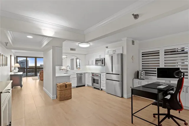 a kitchen with a sink stove and microwave