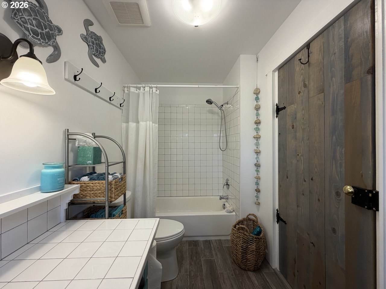 886 1st Street Southeast Bandon, OR 97411 - Photo 25 of 40 a bedroom with a bed and a view of bathroom