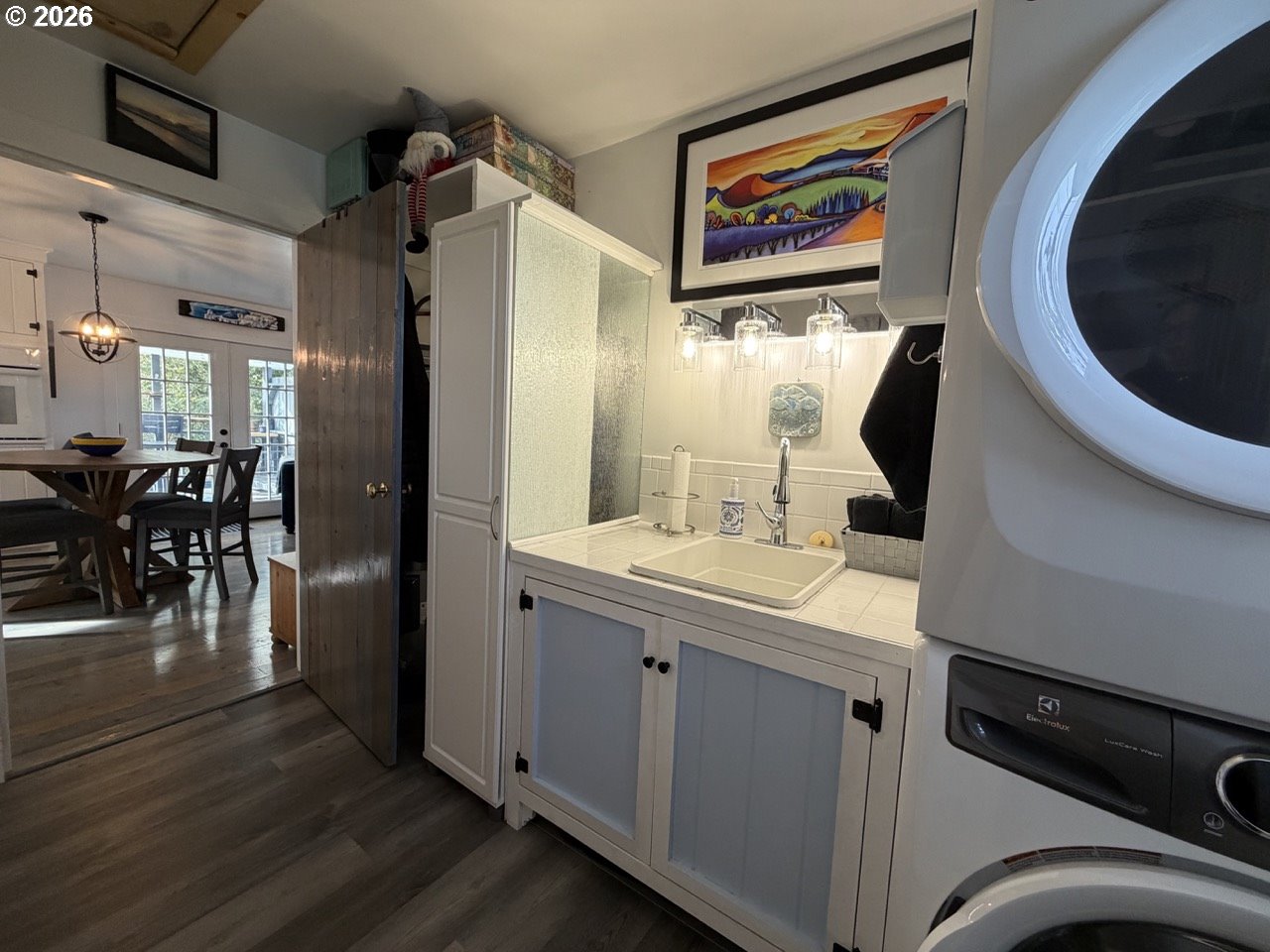 886 1st Street Southeast Bandon, OR 97411 - Photo 26 of 40 a view of a hallway with washer and dryer