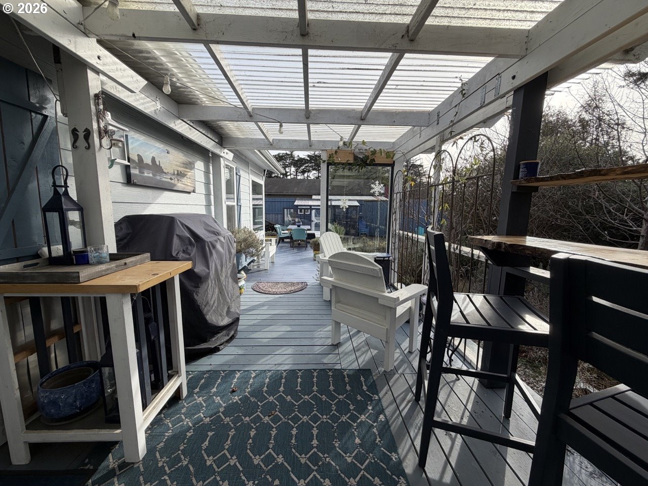 886 1st Street Southeast Bandon, OR 97411 - Photo 29 of 40 a view of a chairs and table in a patio