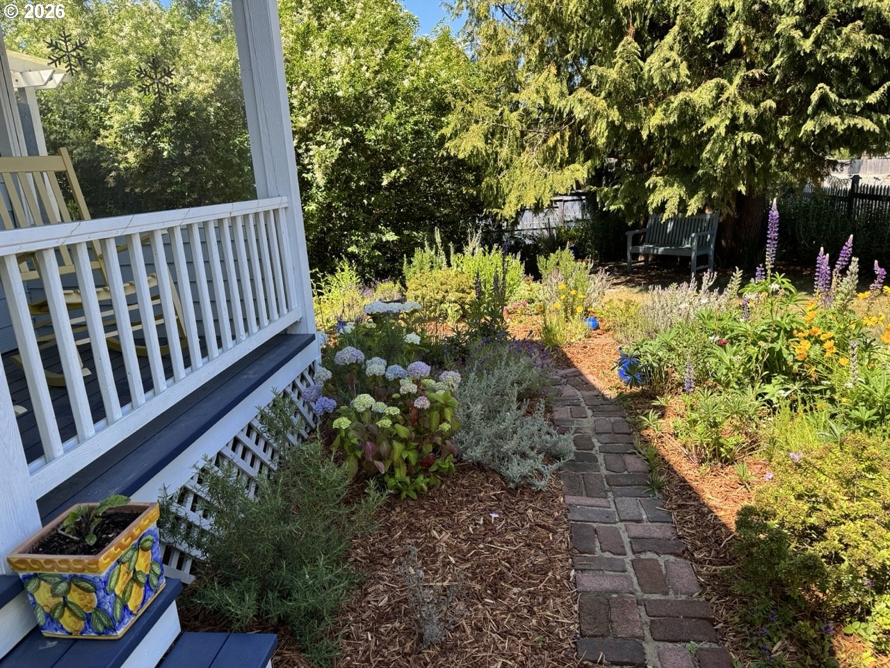 886 1st Street Southeast Bandon, OR 97411 - Photo 35 of 40 a view of a backyard with sitting area