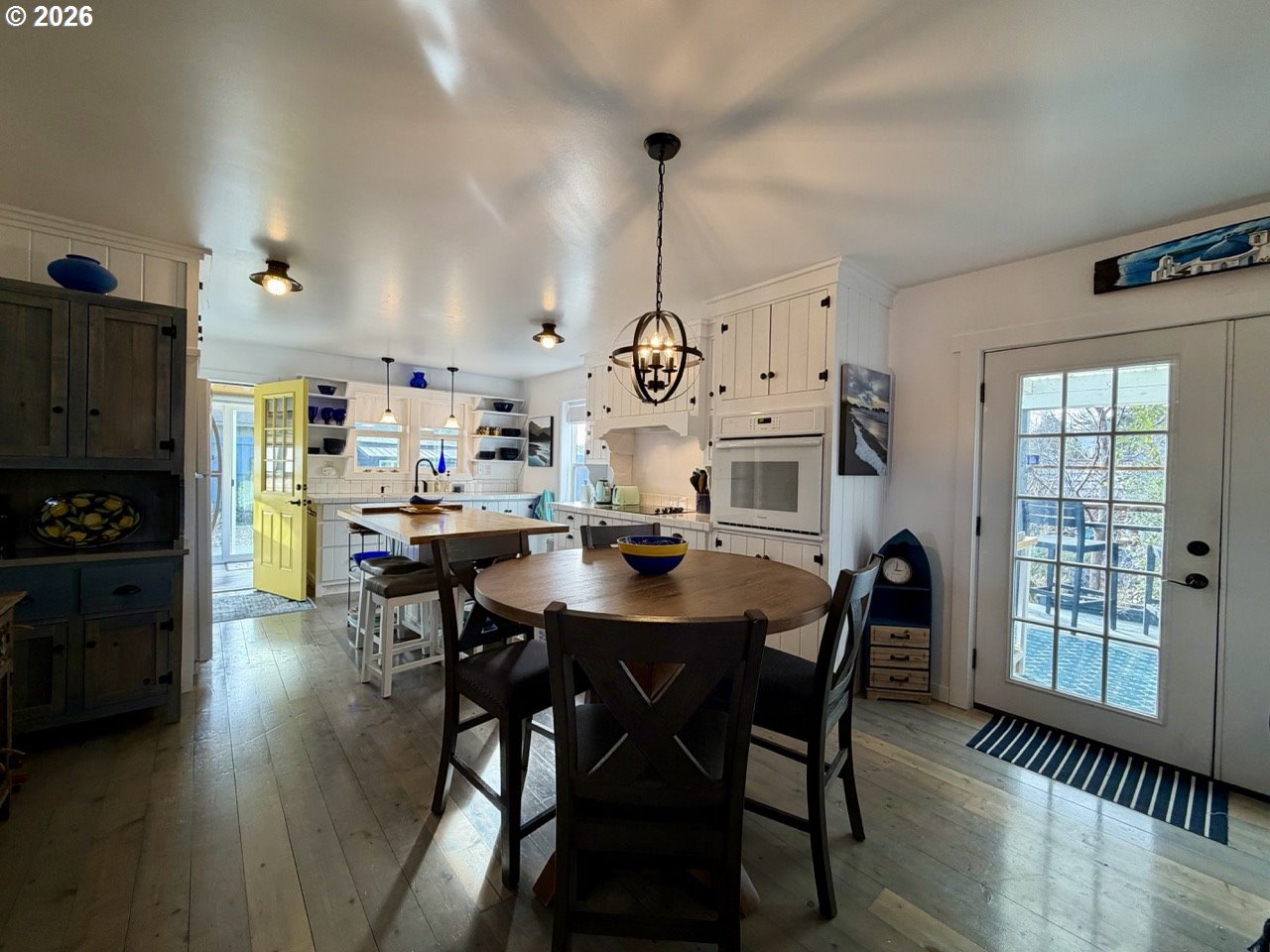 886 1st Street Southeast Bandon, OR 97411 - Photo 6 of 40 a view of a dining room with furniture and wooden floor