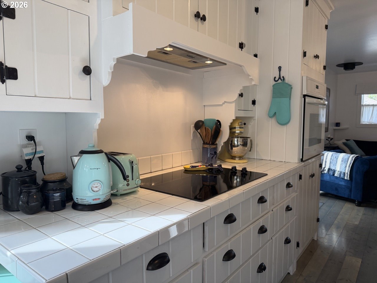 886 1st Street Southeast Bandon, OR 97411 - Photo 8 of 40 a kitchen with kitchen island appliances and cabinets
