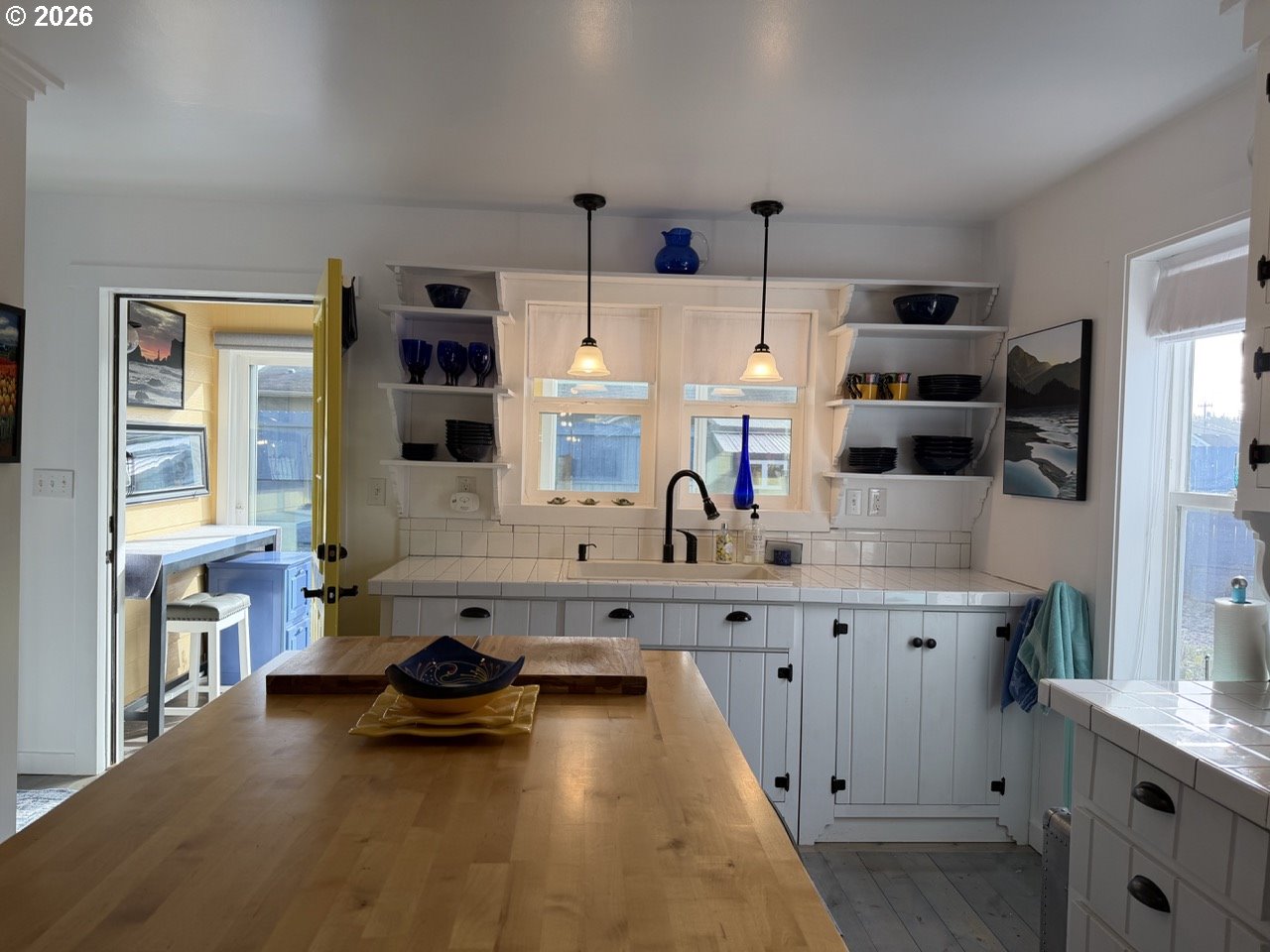 886 1st Street Southeast Bandon, OR 97411 - Photo 10 of 40 a kitchen with cabinets a sink and a stove