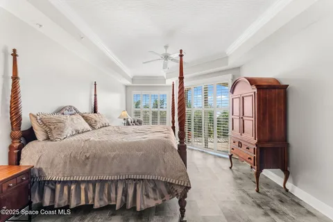 a bedroom with a bed chair and window