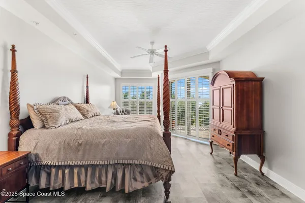 a bedroom with a bed chair and window