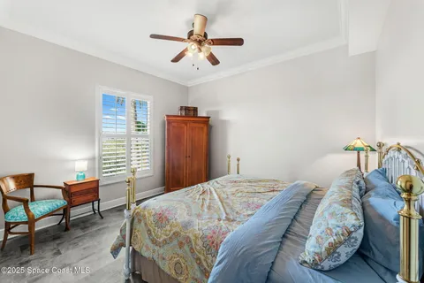 a bed room with a bed and a chair