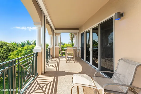 a view of a swimming pool with a lounge chair