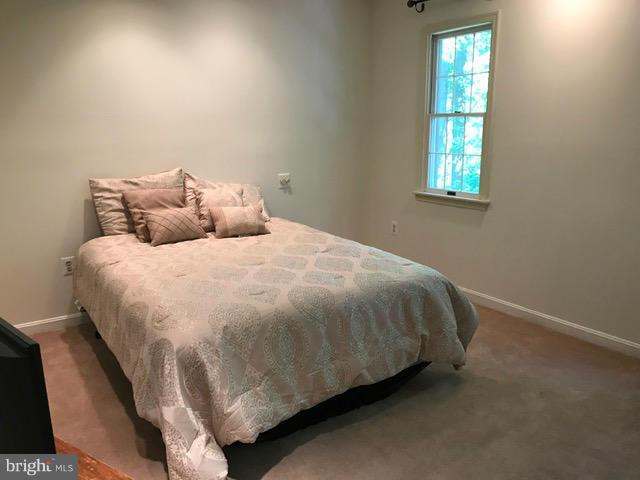 9 Redgate Court Silver Spring, MD 20905 - Photo 15 of 29 a bedroom with a bed and window