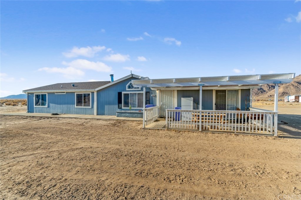 30120 Desert View Road Lucerne Valley, CA 92356 - Photo 1 of 1 a front view of a house with a yard