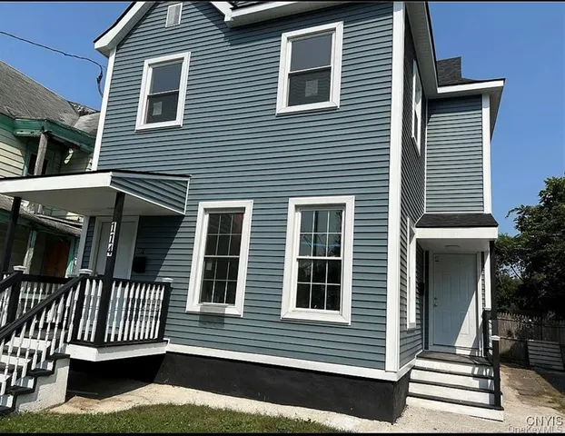 a front view of a house with a porch