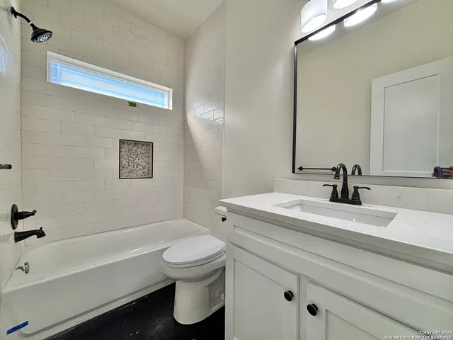 a bathroom with a sink a toilet and a bathtub