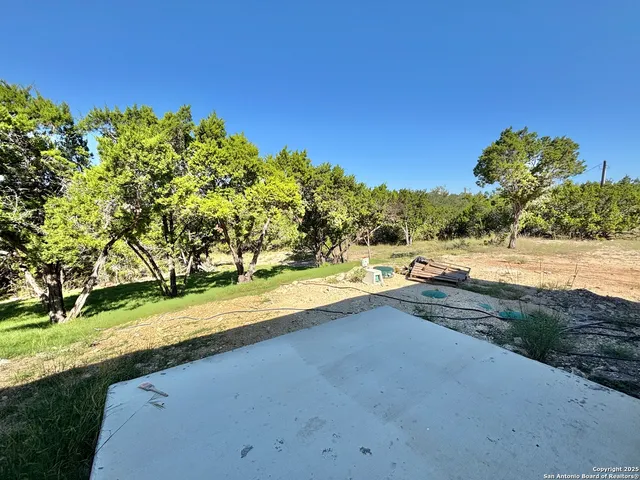 a view of a yard with an outdoor space