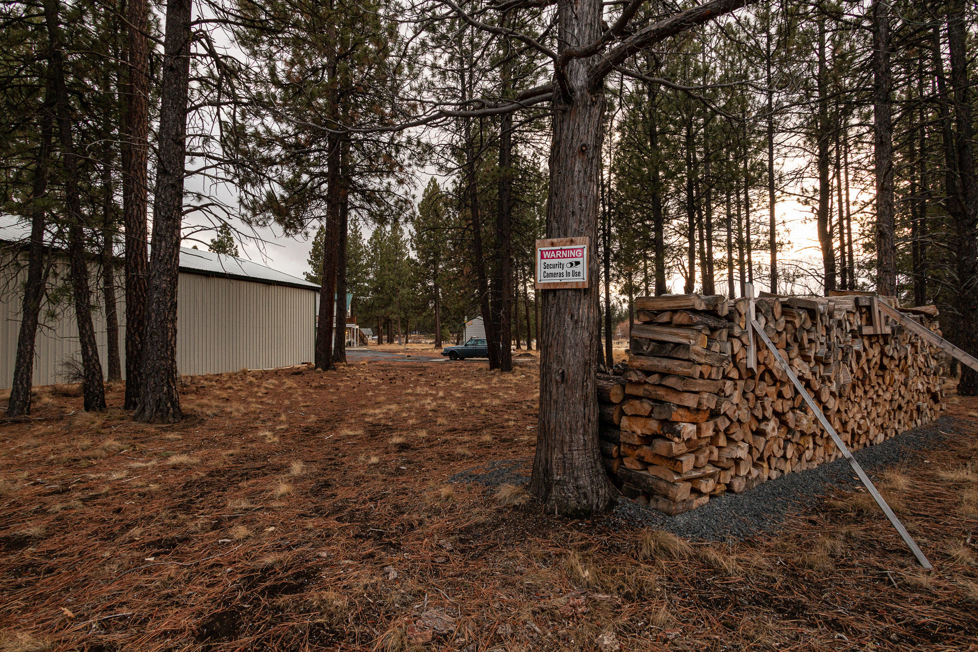 19490 Calico Road Bend, OR 97702 - Photo 60 of 67 a backyard of a house with lots of trees